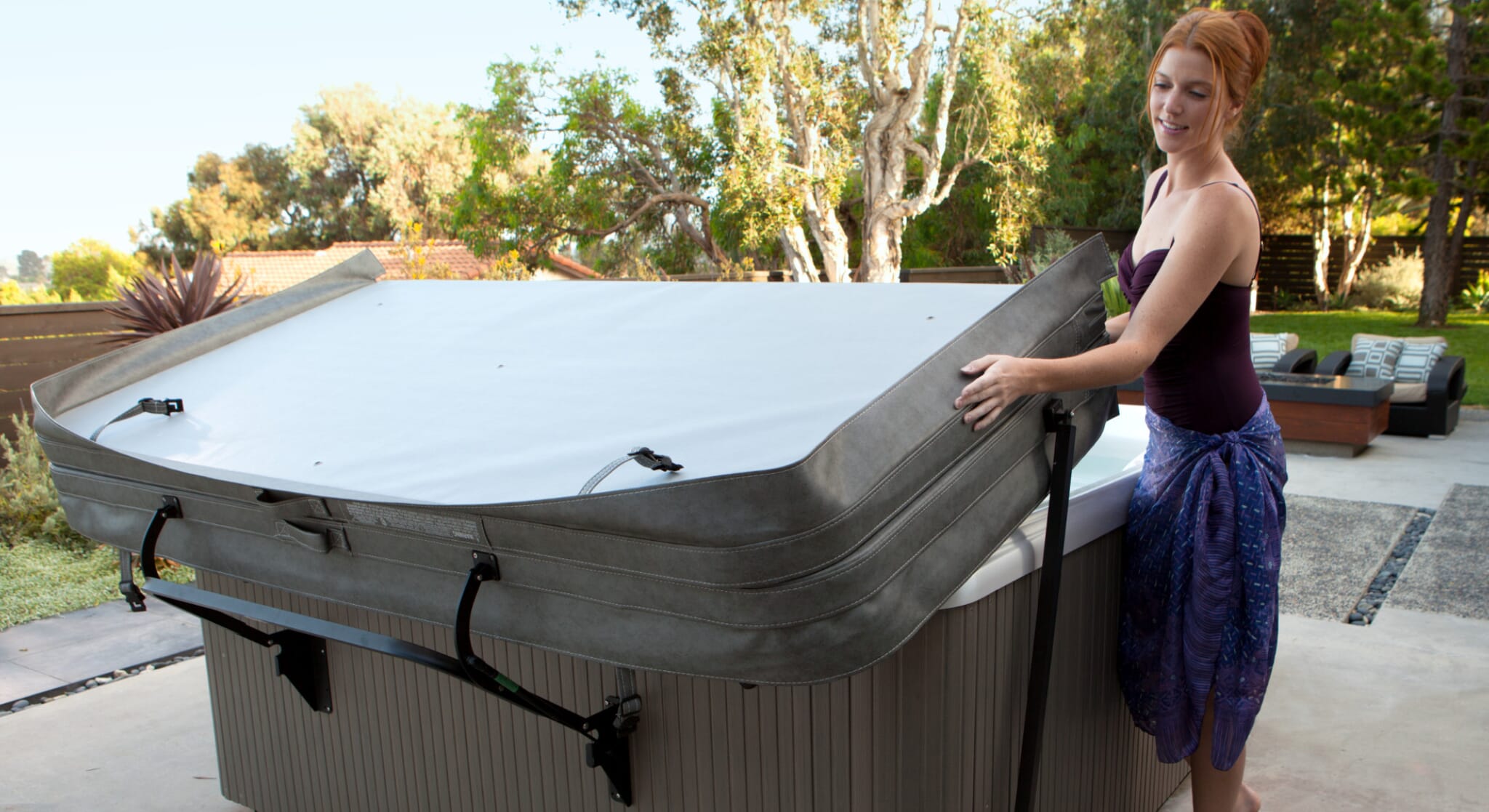 lady moving hot tub cover